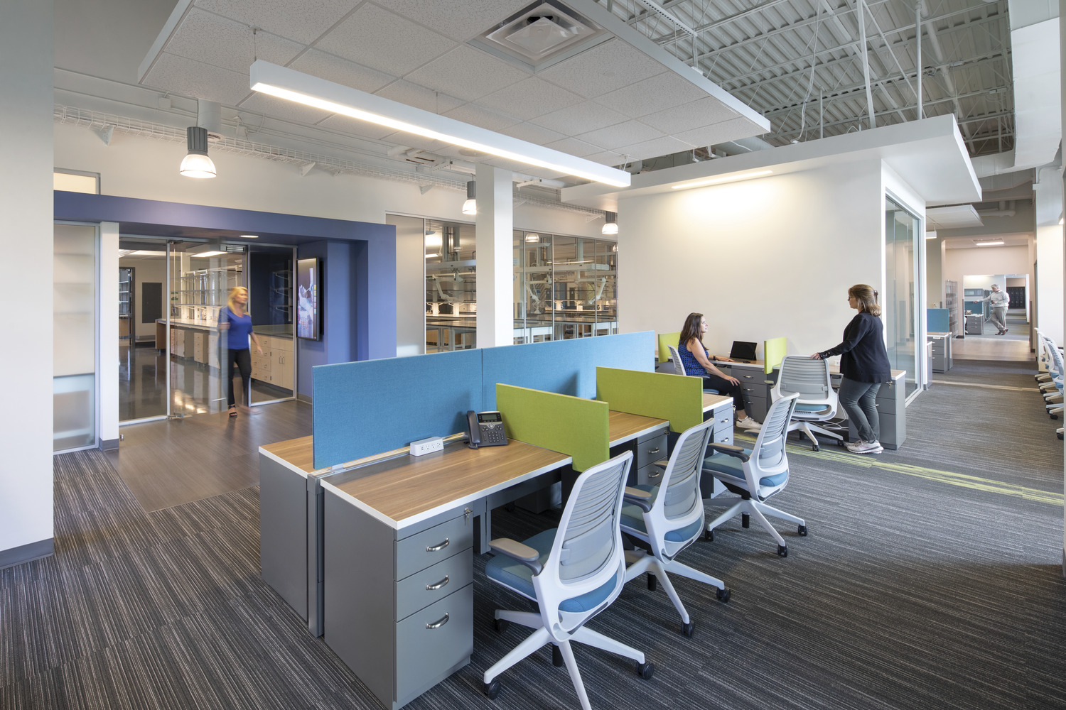 Photo of people at desks
