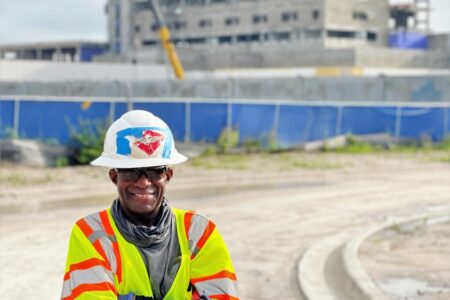 construction worker in front of a building