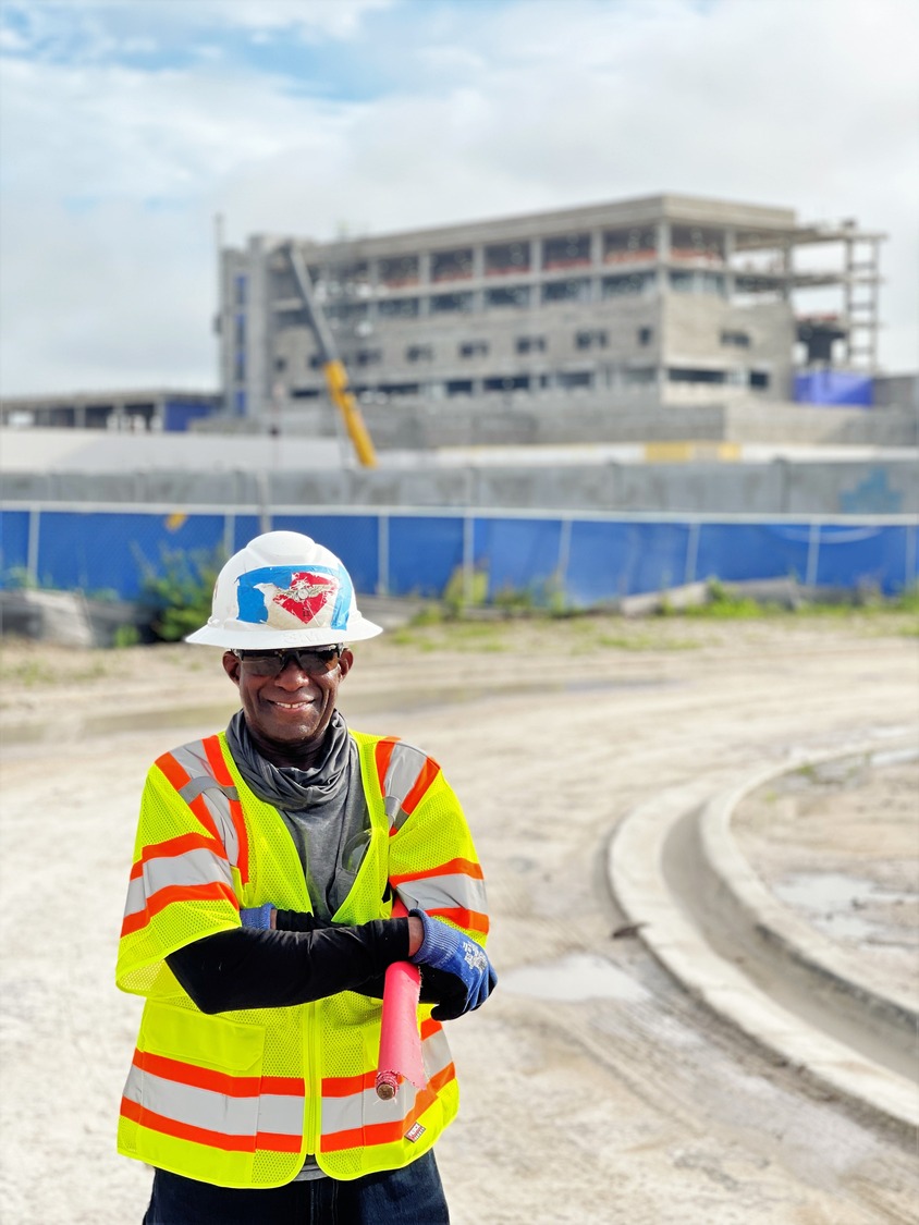 construction worker in front of a building