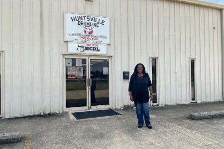 woman standing in front of a business