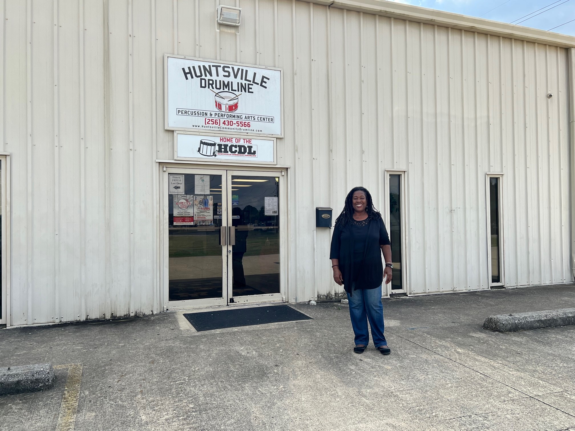 woman standing in front of a business