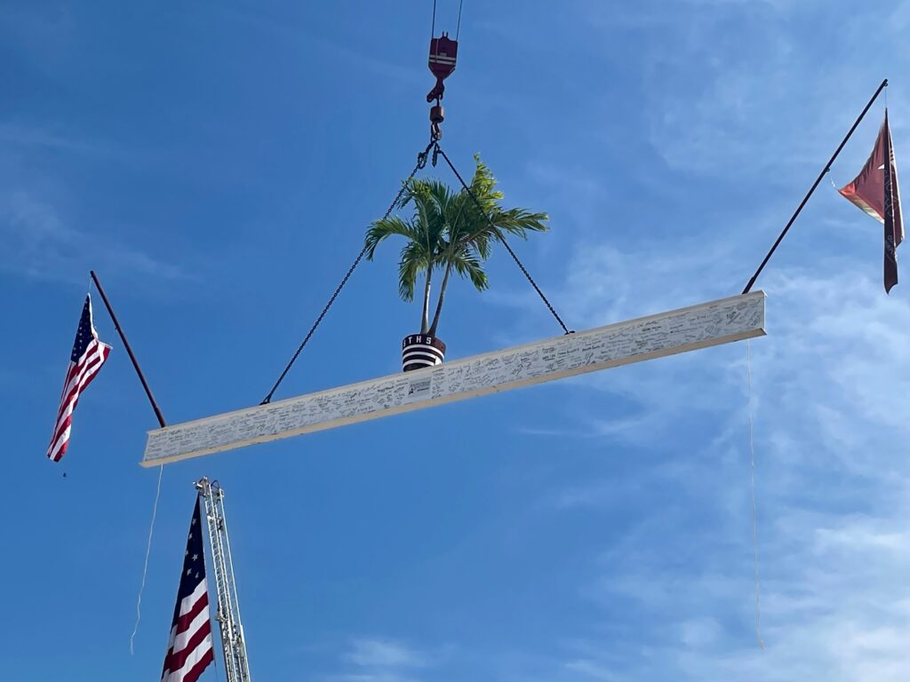 beam with flags on it rising