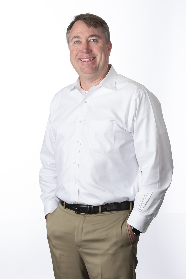Man in a white shirt and khaki pants