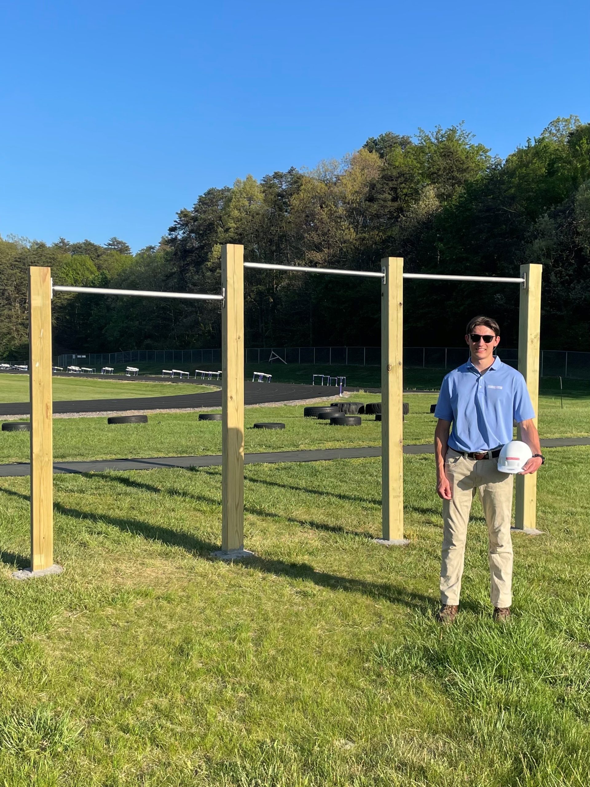 man posting with fitness equipment