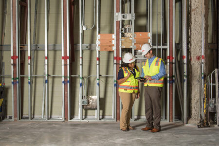 construction workers reviewing plans