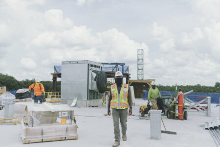 construction workers on a rooftop