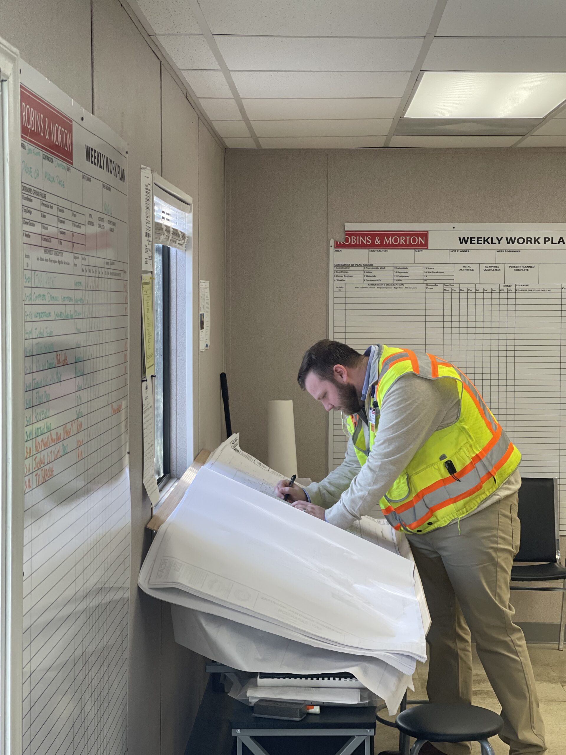 construction worker looking at plans