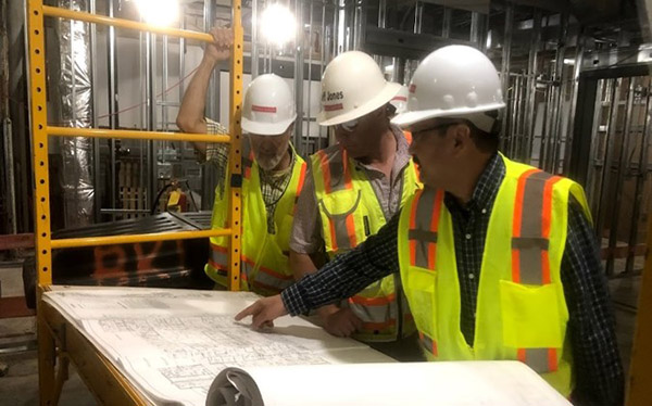 construction workers reviewing plans