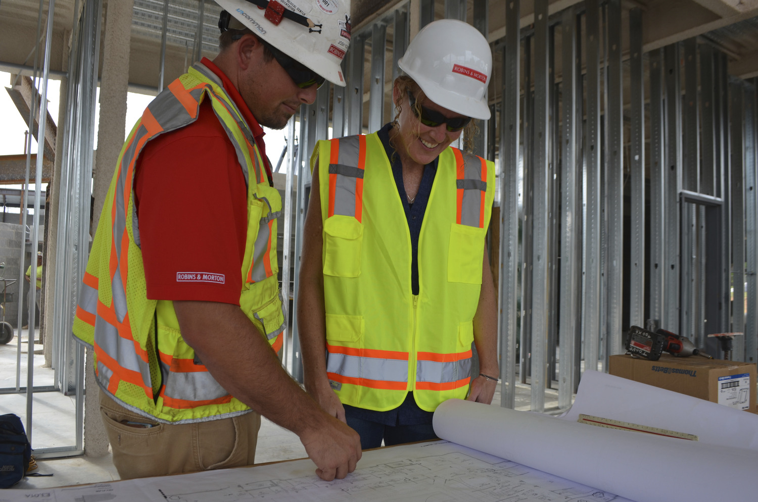 construction workers reading plans