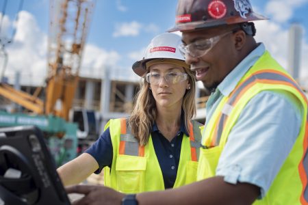 two construction workers reviewing plans