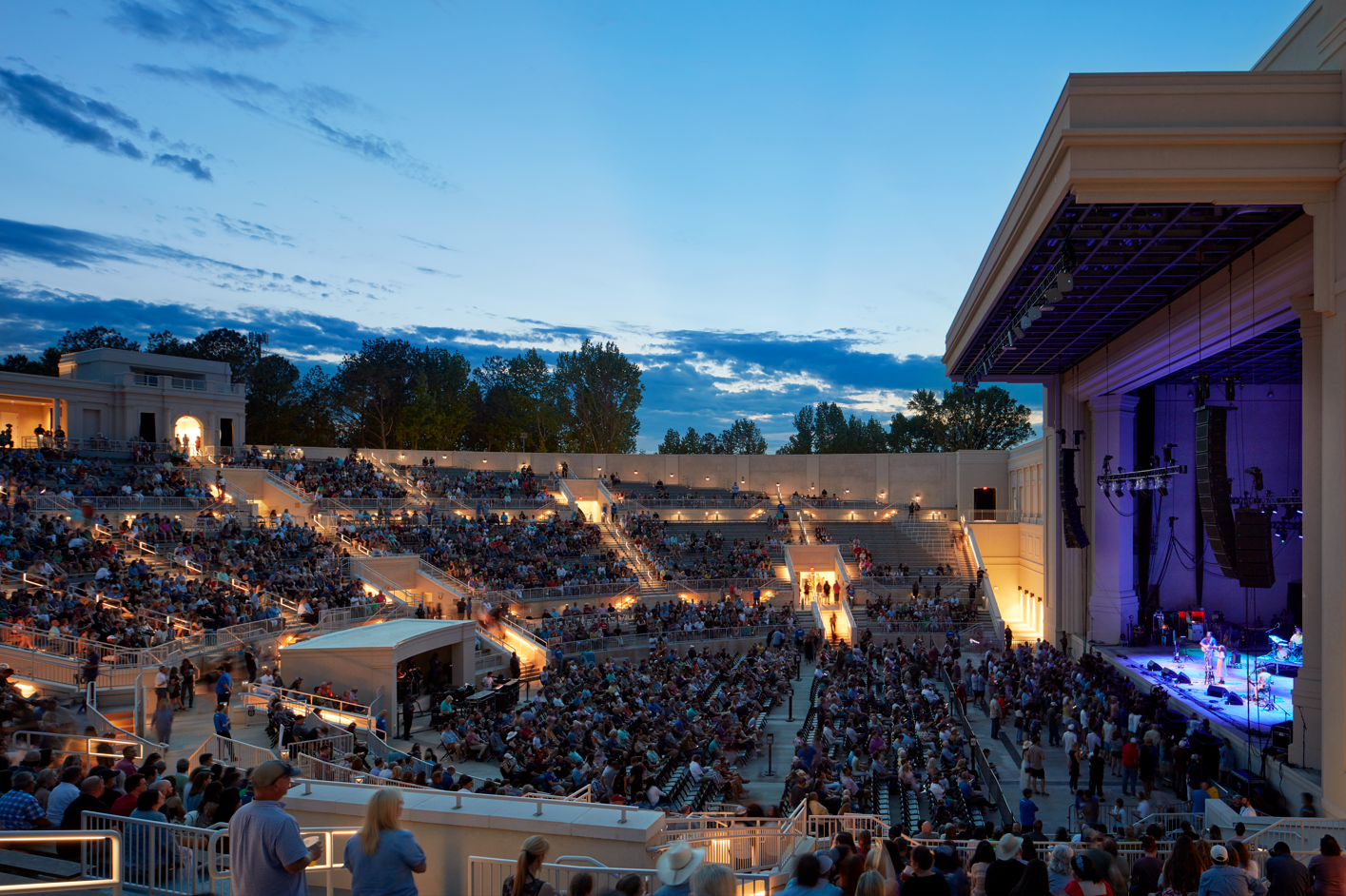 Image of the side view of the stage and crowd within The Orion Amphitheater