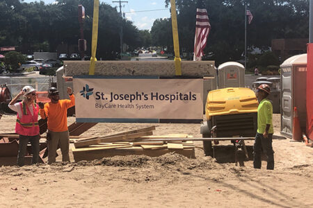 raising a beam on a construction site