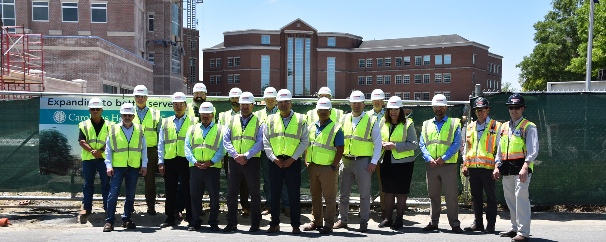 group of people visiting construction site