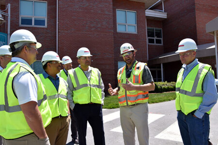 group of people visit construction site