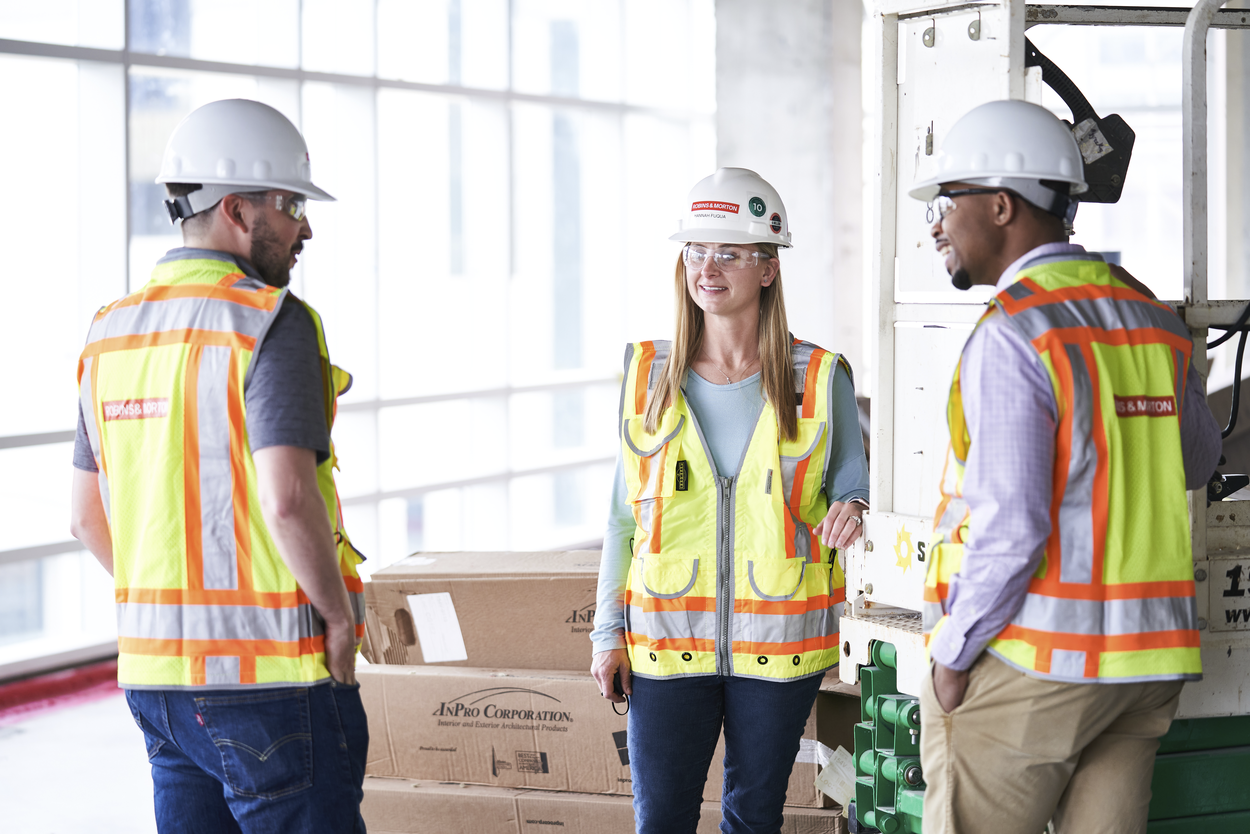 a group of construction workers talking