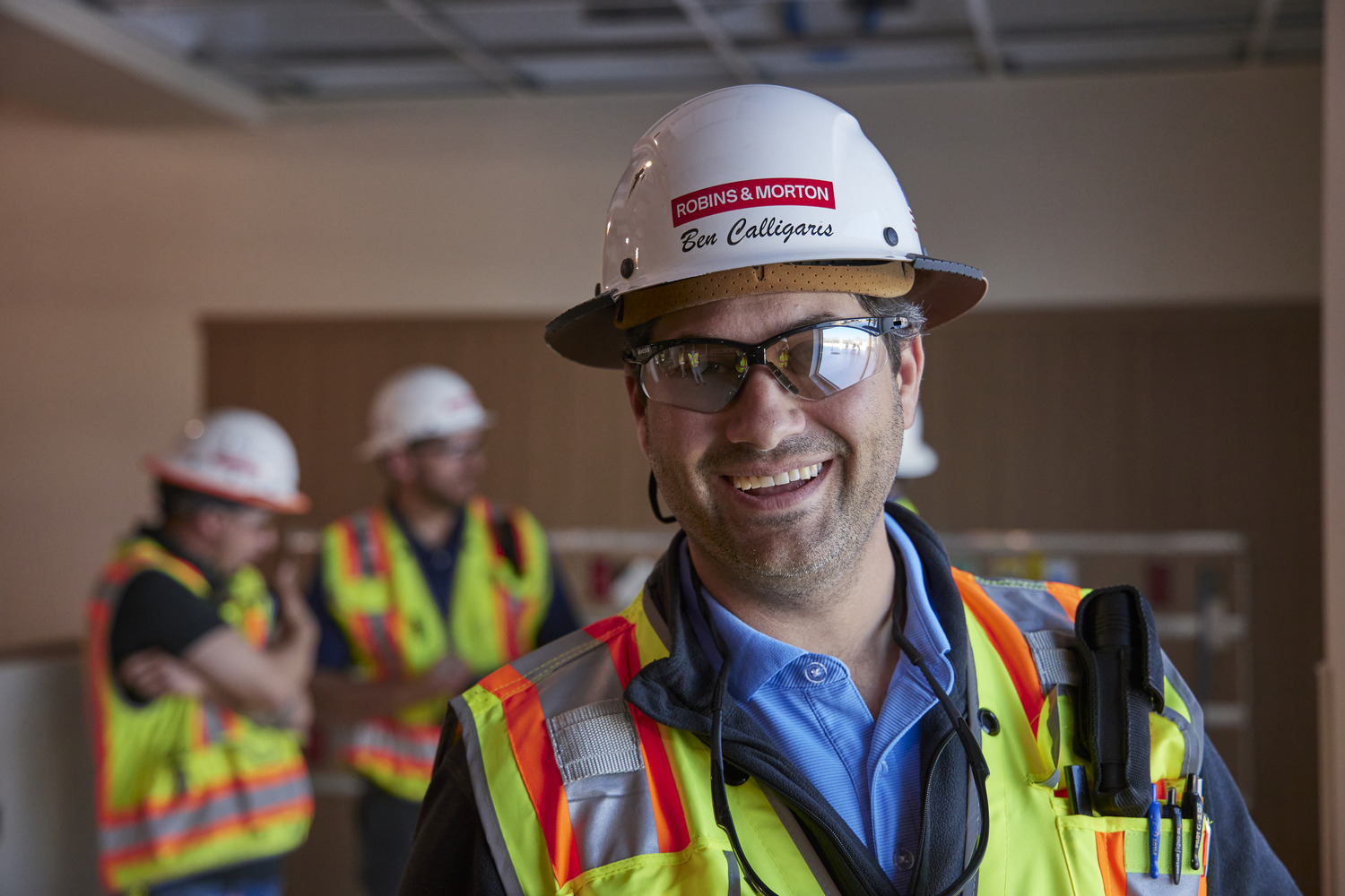 construction worker smiling at the camera