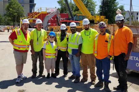 construction workers with child