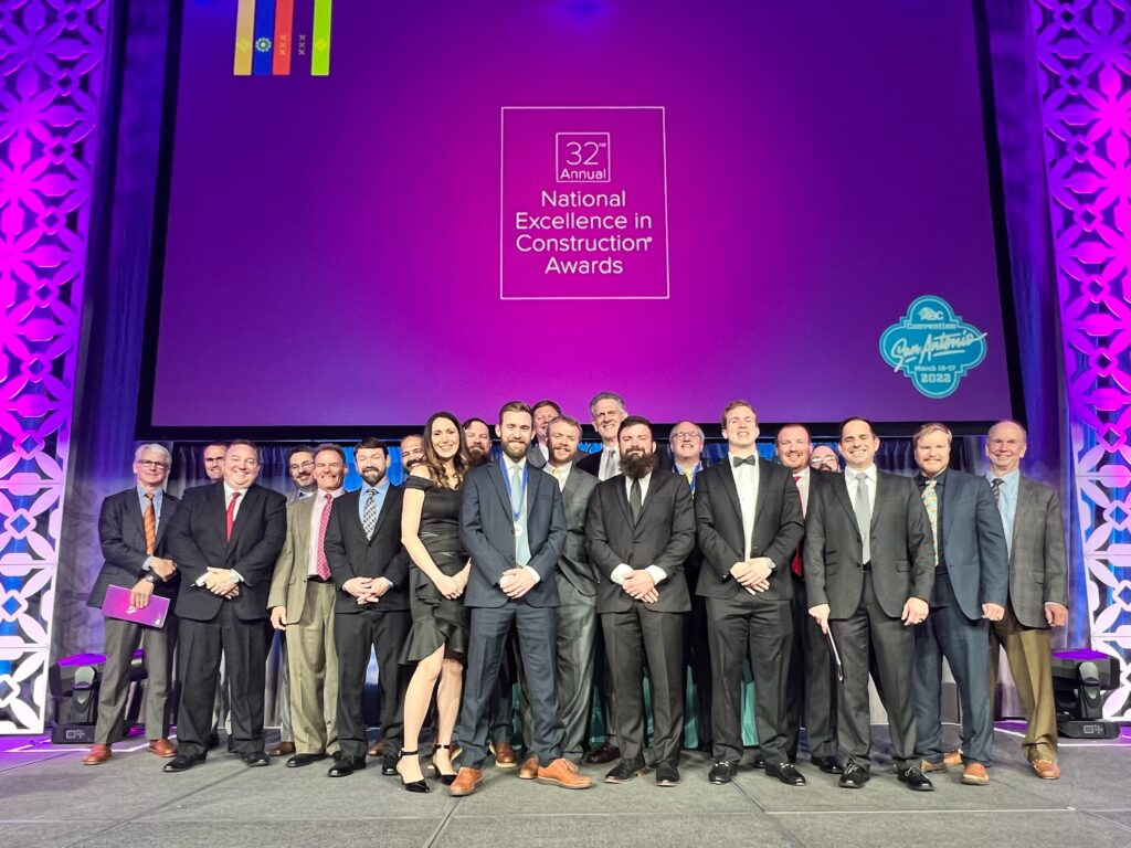 people posing at an award