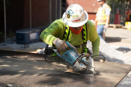 construction worker sawing