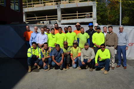 construction workers in front of a jobsite